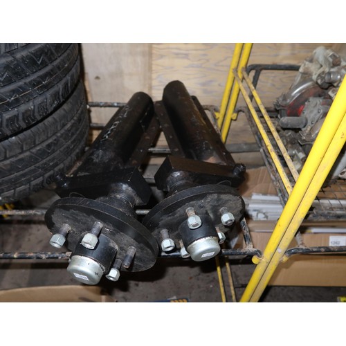 1259 - A pair of 1.5 ton splined adjustable suspension units, a pair of 5 stud trailer rims with MPass 195/... 