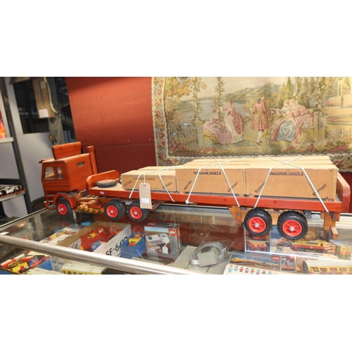 3100 - A large working wooden model of a Scania 142e articulated lorry approx 1.4m in length with flatbed t... 