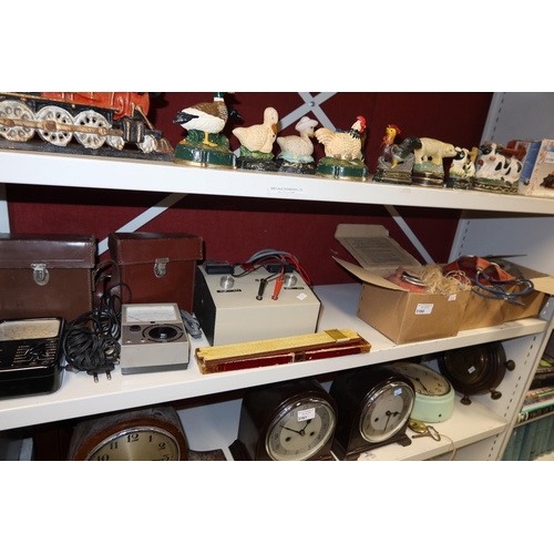 3160 - 3 vintage child's gas masks, vintage slide rule & 3 vintage electrical testers (one shelf)