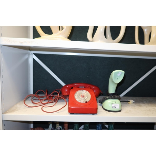 3174 - A vintage red dial telephone and a green retro style telephone