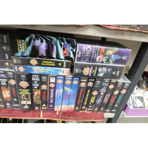 3121 - A large collection over 100 Doctor Who VHS cassettes, contents of 4 shelves