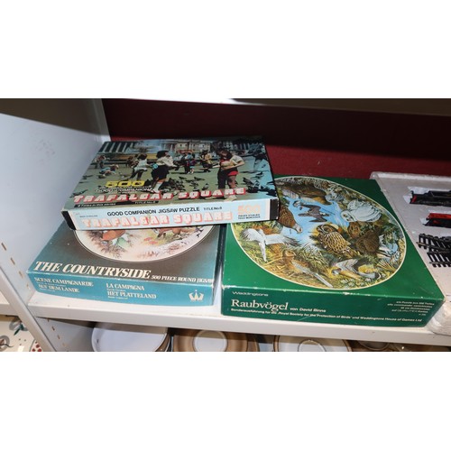3165 - Vintage Hornby battery operated train set and a quantity of miscellaneous other games and jigsaws et... 