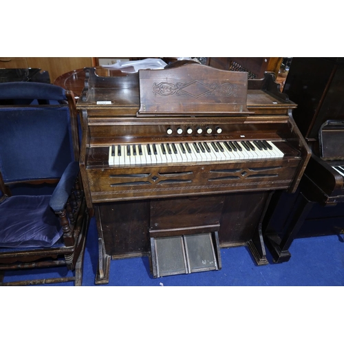 An Edwardian carved mahogany cased harmonium by the Estey Organ Company