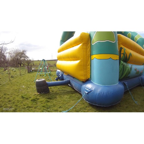 2092 - A 20 x 23ft inflatable bouncy castle (frog) supplied with an inflating blower 240v, a rain cover and... 