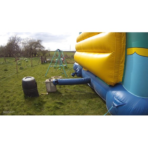 2092 - A 20 x 23ft inflatable bouncy castle (frog) supplied with an inflating blower 240v, a rain cover and... 