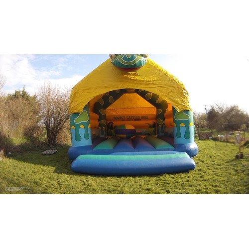 2092 - A 20 x 23ft inflatable bouncy castle (frog) supplied with an inflating blower 240v, a rain cover and... 