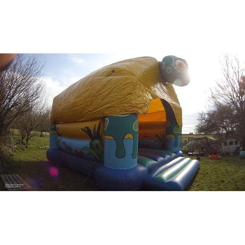 2092 - A 20 x 23ft inflatable bouncy castle (frog) supplied with an inflating blower 240v, a rain cover and... 