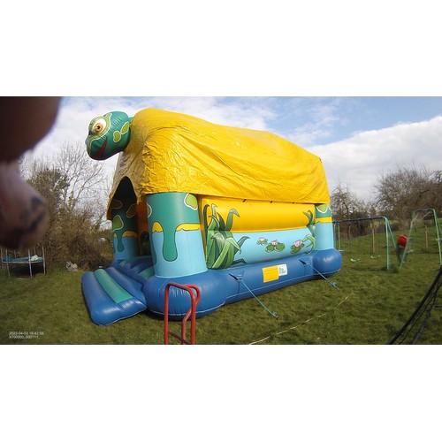 2092 - A 20 x 23ft inflatable bouncy castle (frog) supplied with an inflating blower 240v, a rain cover and... 