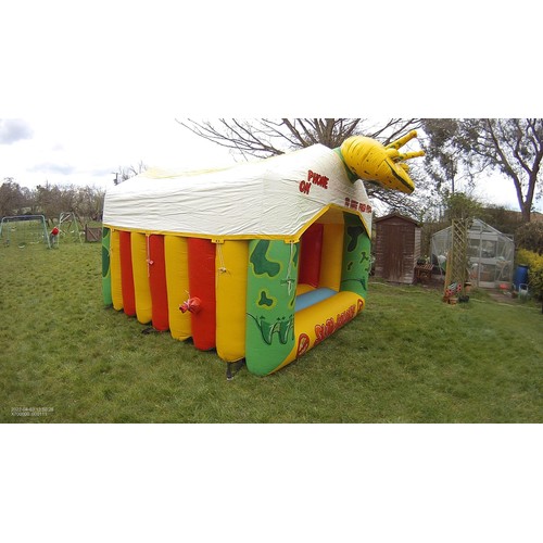 2093 - A 10 x 12ft inflatable bouncy castle (frog) supplied with an inflating blower 240v, a rain cover and... 