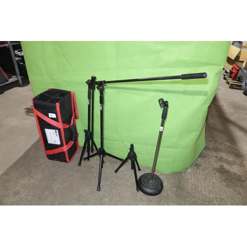 82 - 4 various microphone stands and 1 soft carry / storage bag