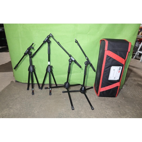 88 - 4 short black metal folding tripod microphone stands supplied with a soft carry / storage bag compri... 