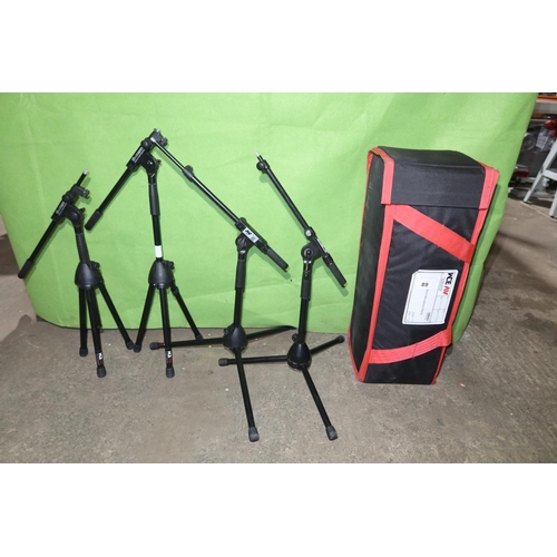 89 - 4 x short black metal folding tripod microphone stands by K & M supplied with a soft carry / storage... 