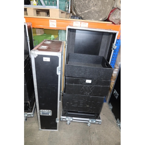 282 - 1 wheeled storage flight case with two part lift off top containing a various black stacking storage... 