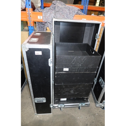 283 - 1 wheeled storage flight case with two part lift off top containing a various black stacking storage... 