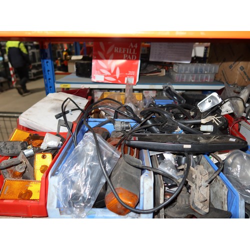 138 - A quantity of plastic Lin type storage bins containing various auto related items including indicato... 