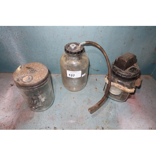 127 - 3 various vintage wind screen washer bottles. Contents of 1 shelf