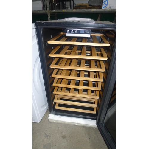 1122 - An unused under counter single smoked glass door wifi wine fridge by Hoover type H-Wine 500 HWC154EE... 