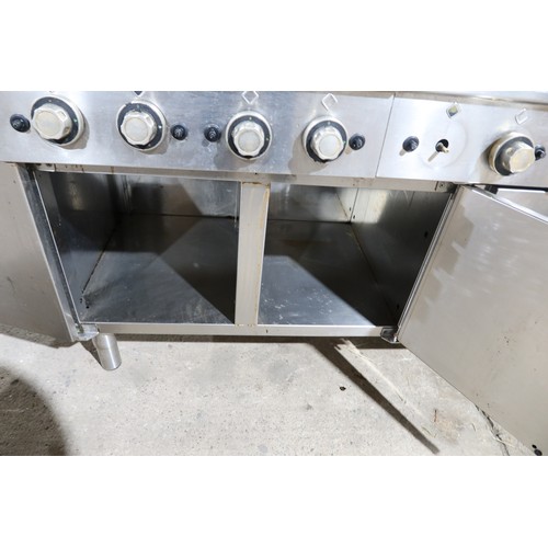 1144 - A commercial stainless steel 8 ring gas hob with 3 door storage cupboard beneath, unit is 2 x 4 ring... 