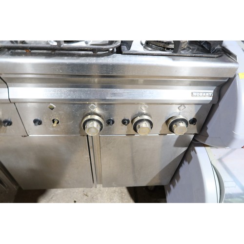 1144 - A commercial stainless steel 8 ring gas hob with 3 door storage cupboard beneath, unit is 2 x 4 ring... 