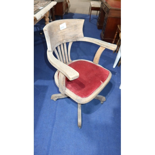 3559 - A vintage swivel office elbow chair