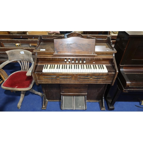 3560 - An Edwardian carved mahogany cased harmonium by the Estey Organ Company