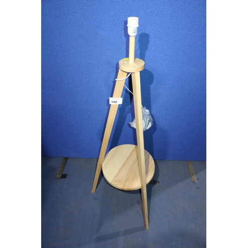 140 - A wooden tripod floor lamp only, no shade.