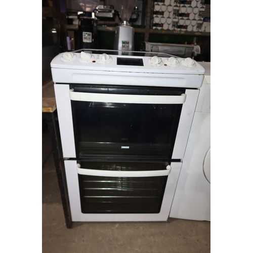 1116 - A household electric fan oven with 4 rings, grill, top oven and main oven below - trade