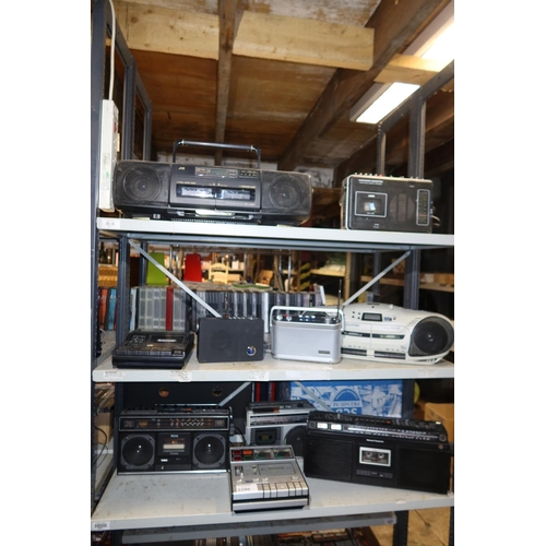 2290 - A quantity of various electronic items including radios and cassette players, contents of 3 shelves ... 