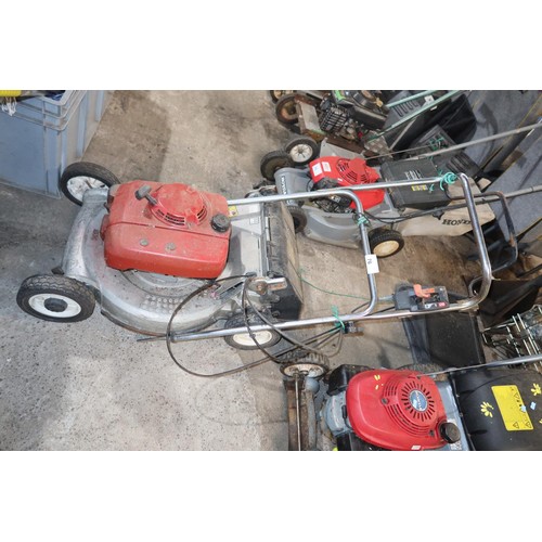 76 - 1 Honda SX petrol engine lawn mower (handle requires refitting) and 1 Honda petrol engine lawnmower ... 