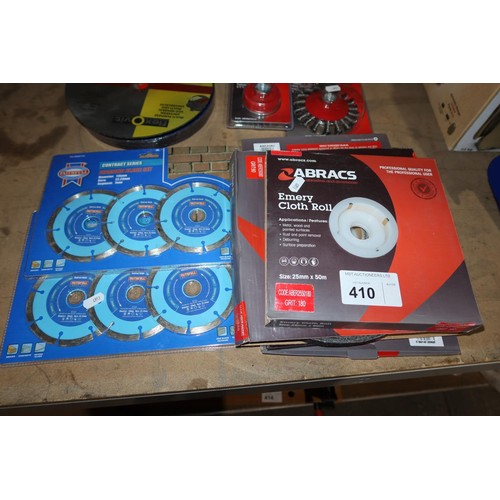 410 - A quantity of various cutting disks, wire cup brushes, emery cloth etc - Not practical to list in de... 