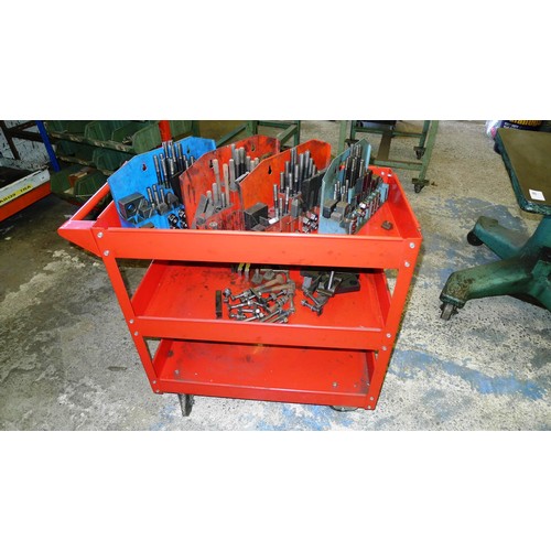 75 - 1 red metal workshop trolley containing a quantity of clamping kits