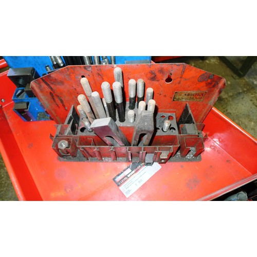 75 - 1 red metal workshop trolley containing a quantity of clamping kits