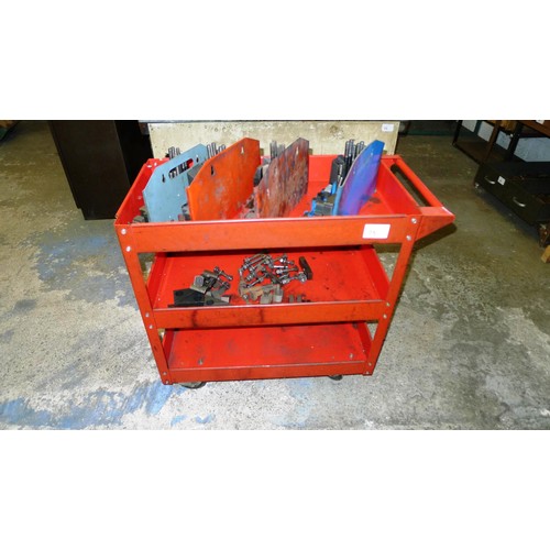 75 - 1 red metal workshop trolley containing a quantity of clamping kits