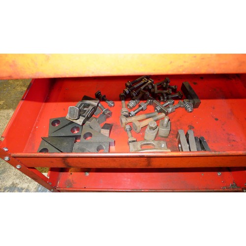 75 - 1 red metal workshop trolley containing a quantity of clamping kits