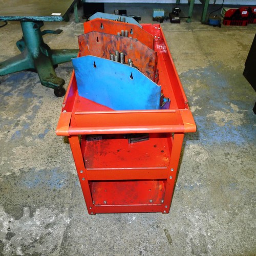 75 - 1 red metal workshop trolley containing a quantity of clamping kits