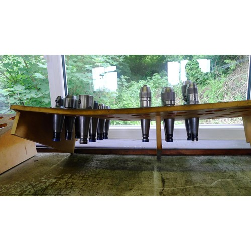 87 - 1 bench top wooden storage rack containing 6 machine chucks and 8 various straight shank tool holder... 