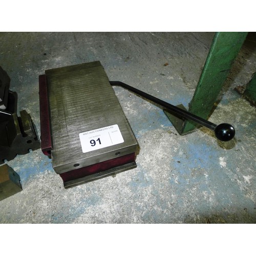 91 - 1 magnetic chuck approx 25 x 12.5cm, 1 compound angle fixture and several various V blocks