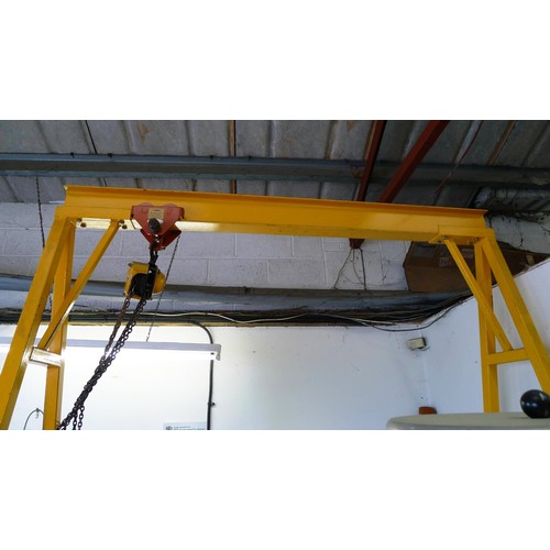 127 - 1 yellow metal portable gantry crane fitted with a travelling cradle and a Davy Morris  500kg chain ... 