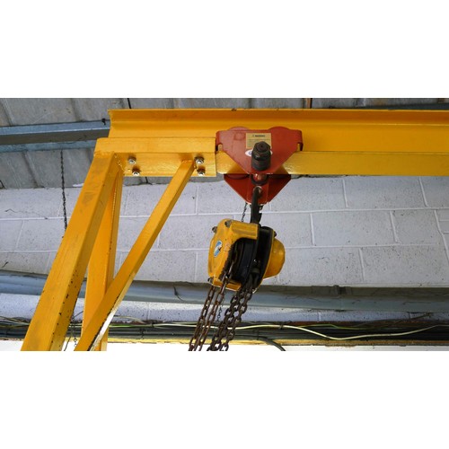 127 - 1 yellow metal portable gantry crane fitted with a travelling cradle and a Davy Morris  500kg chain ... 