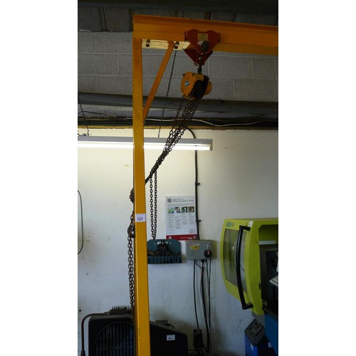 127 - 1 yellow metal portable gantry crane fitted with a travelling cradle and a Davy Morris  500kg chain ... 