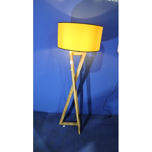 93 - 1 floor standing wooden tripod lamp with orange shade