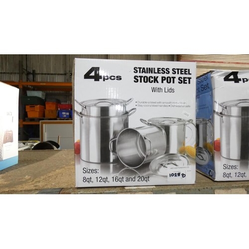 1028B - A unused 4 piece stainless steel pot set with lids, boxed