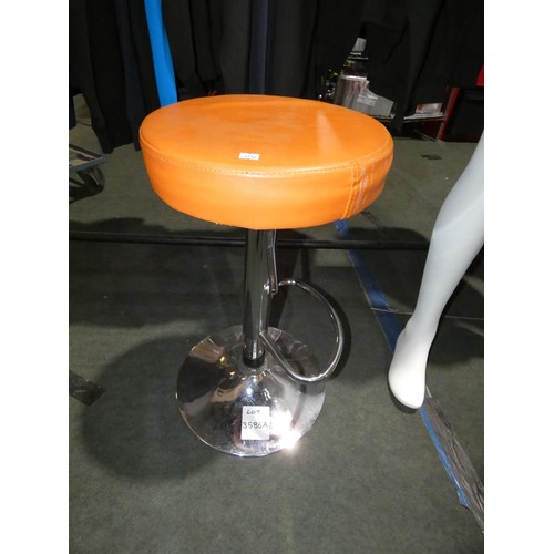 3586A - A used orange upholstered rise & fall tall stool