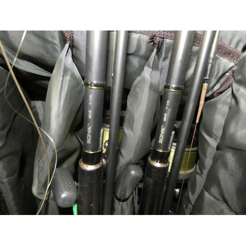 3037 - An Advantage Woodland camouflage rod holdall containing 3 x Sonik SK4 fishing rods, 3 x Shimano WP r... 