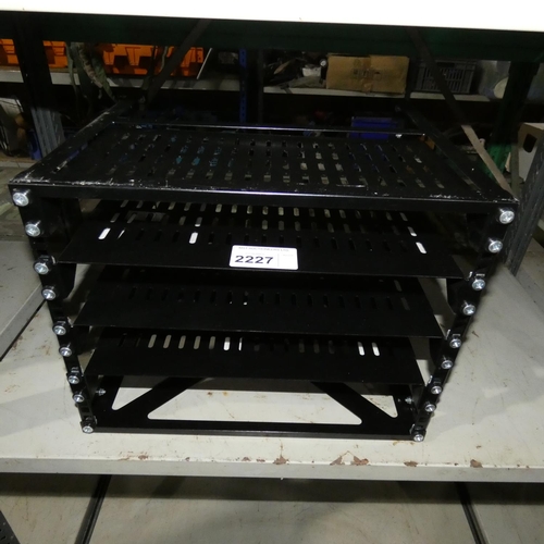 2227 - A compact black metal rack mount unit