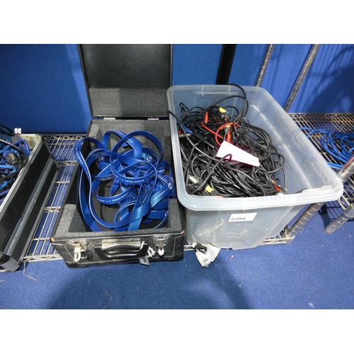 2394 - 1 black storage box containing a long SCART lead and 1 plastic box containing a quantity of various ... 