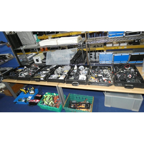 2415 - A quantity of various items including leads, power supplies etc. Contents of 7 black lids / box base... 