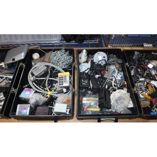 2415 - A quantity of various items including leads, power supplies etc. Contents of 7 black lids / box base... 