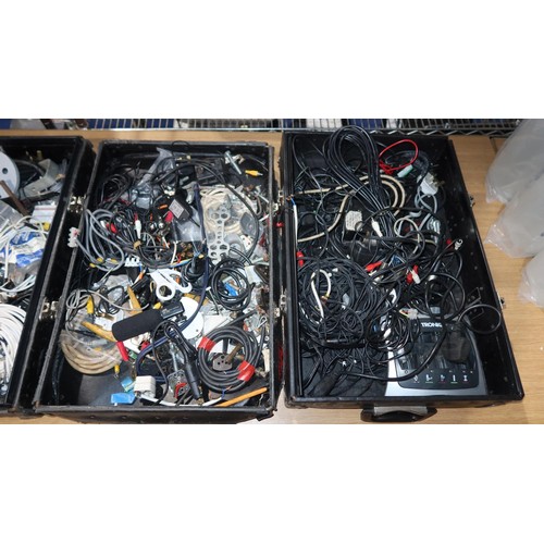 2415 - A quantity of various items including leads, power supplies etc. Contents of 7 black lids / box base... 