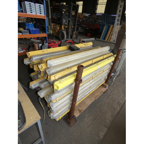 104 - A quantity of approx 64 yellow plastic fluorescent light fittings - Contents of bottom stillage whic... 